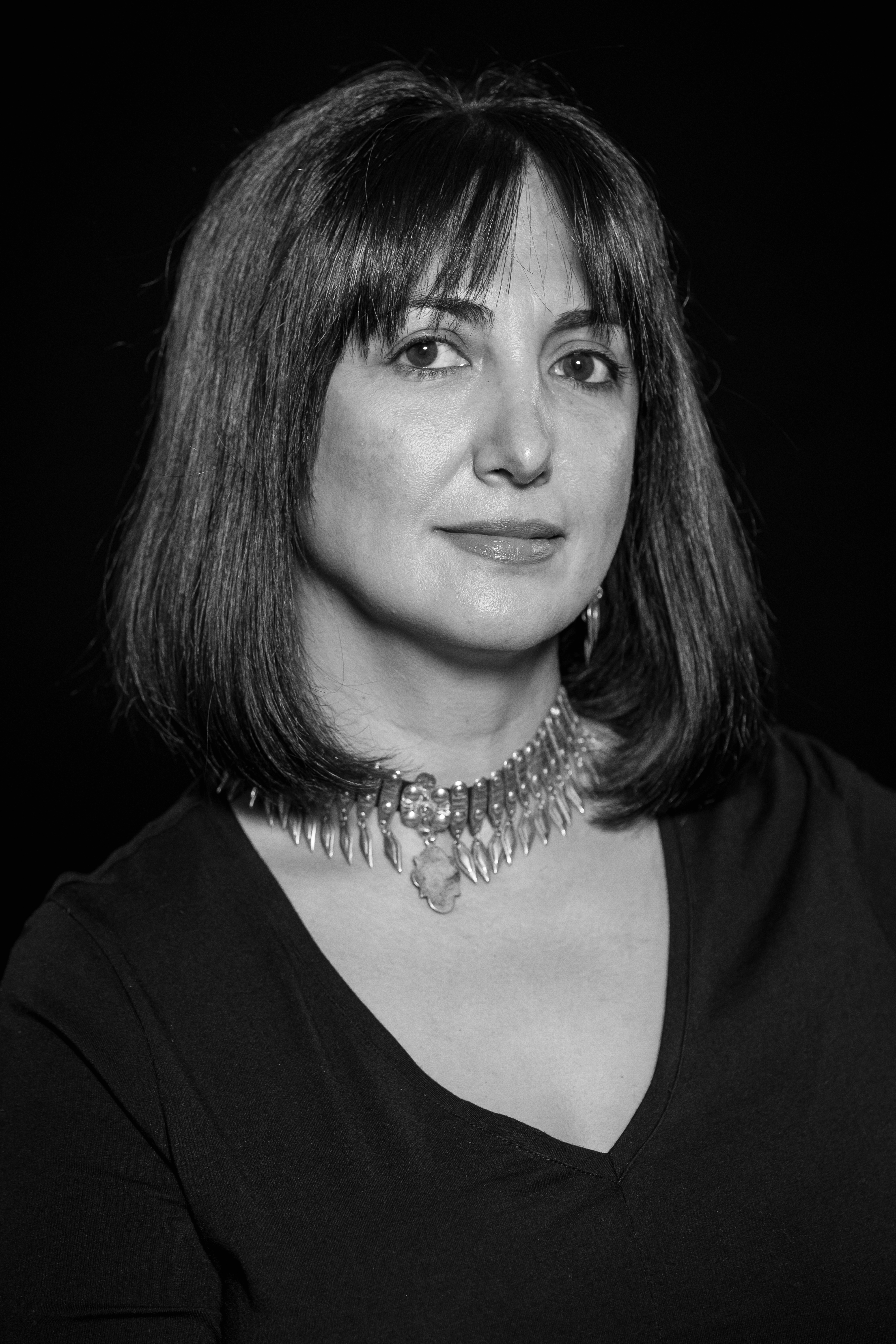 Inna Sahakyan looks directly at the camera. Photo in black and white