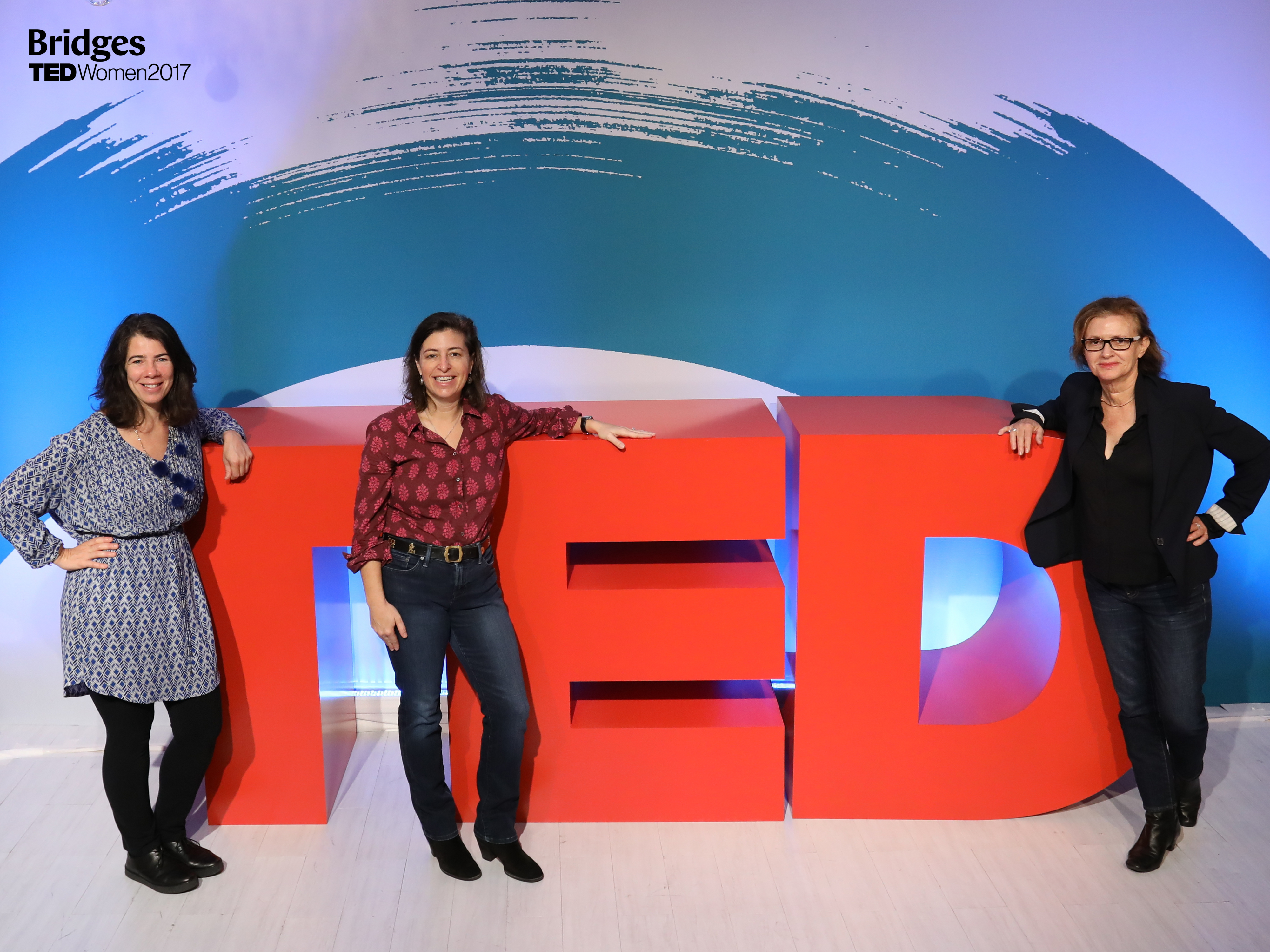 Founders and Jenni Wolfson standing by TEDWomen 2017 Logo