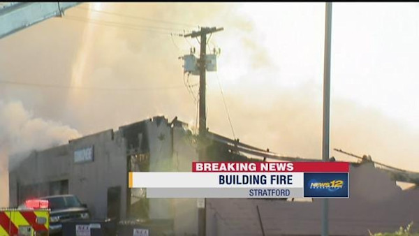 Massive fire causes building collapse on Research Drive in Stratford
