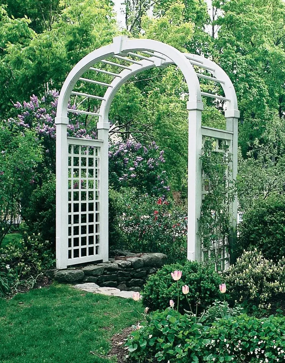 Crafted in Solid Cellular Vinyl with 4" square posts, 3½" square elliptical arch with keystone. Offered with or without a Chippendale bench. 5' H x 34" W horizontal/vertical lattice side panels with 5" openings. 1¼" diameter spindles. 41" D. Available 4½' or 6'W. Painted white.