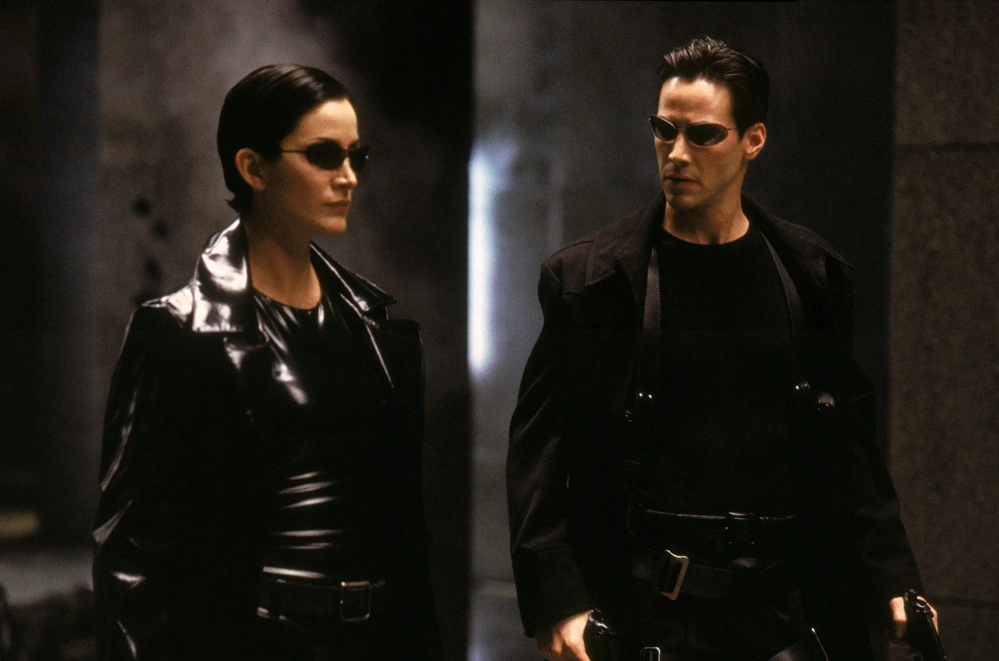 Keanu Reeves as Neo and Carrie-Anne Moss as Trinity
