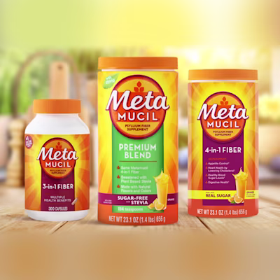 3 bottles of Metamucil 3-in-1 daily fiber capsules, Premium blend orange sugar-free with stevia powder and 4-in-1 fiber powder with real sugar place on a wooden table.