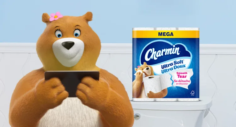 Molly looking at tablet in bathroom