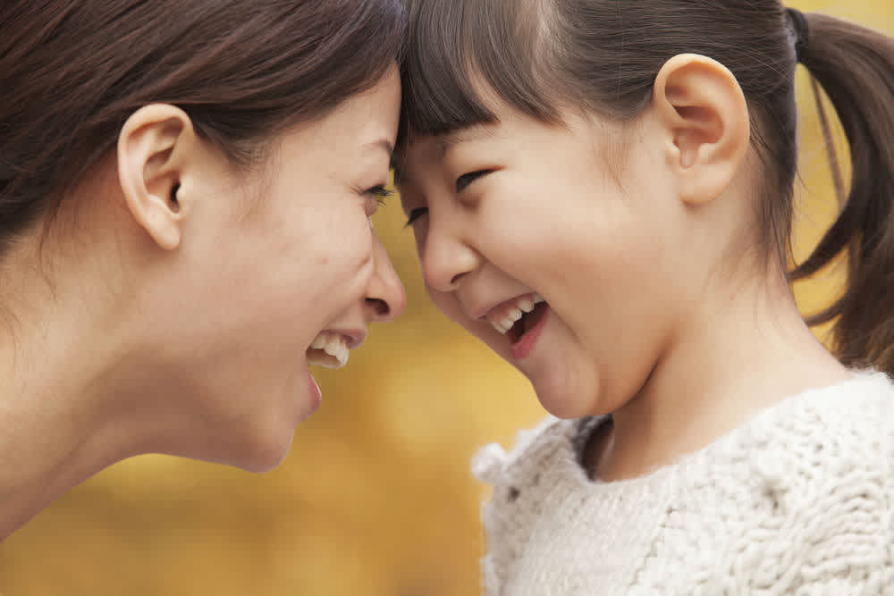 Mother and child laughing together