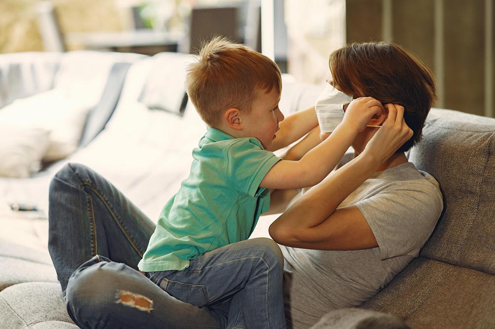 Boy and mother with mask