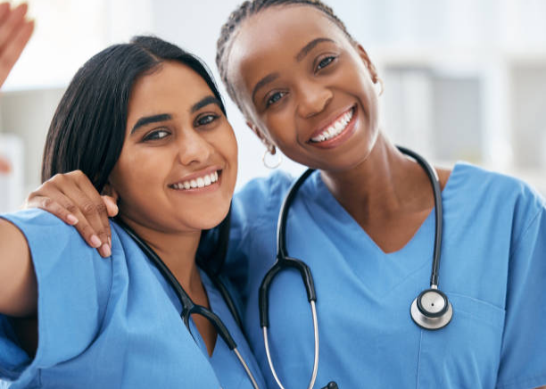 Two Nurses Working in Healthcare.png