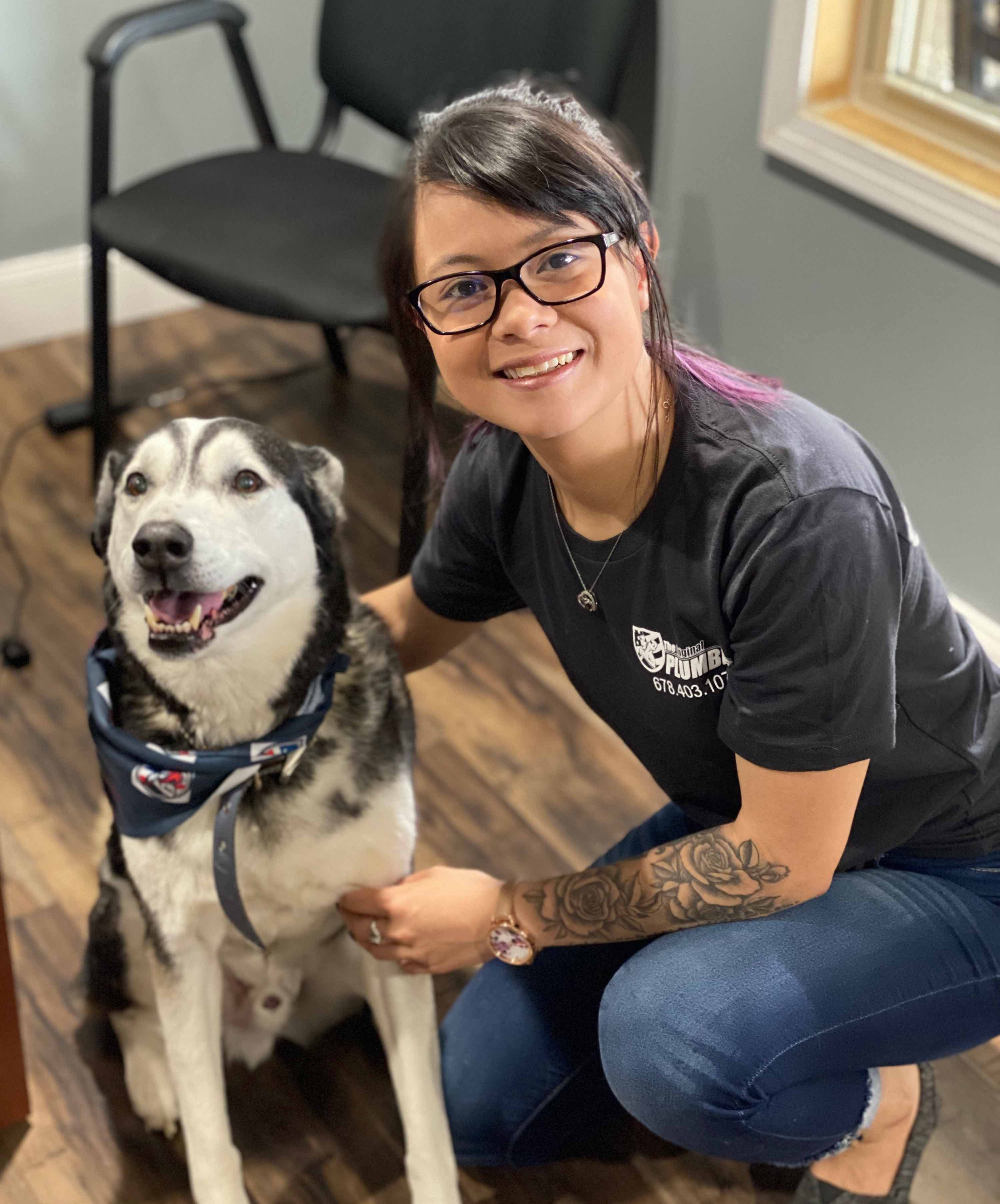 Catherine Keo with Din, the shop dog of The Original Plumber