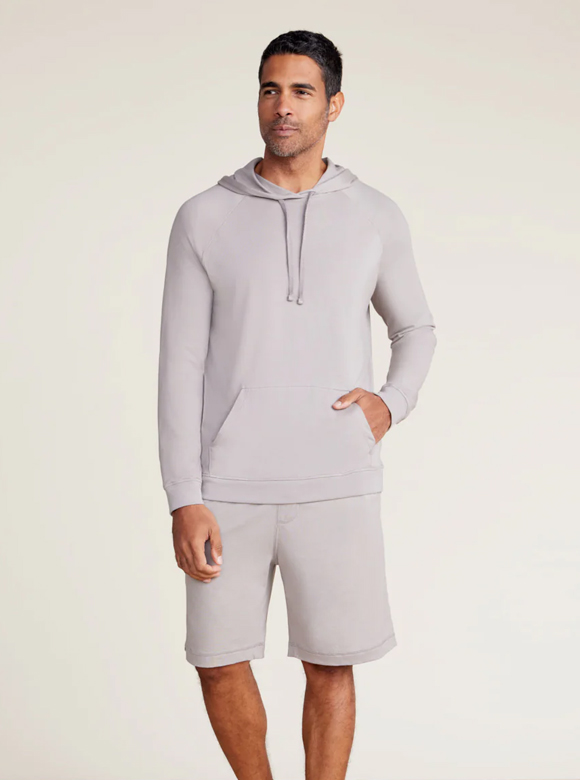 Male model wearing Malibu Collection Pima Hoodie and Jersey Shorts in Nickel.