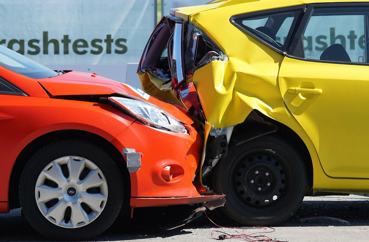 Car crash scene illustrating the importance of comprehensive car insurance coverage