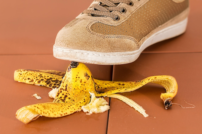 A foot about to step on a banana peel, representing the common pitfalls of insurance auto-renewals that Quashed helps New Zealanders avoid by comparing the market in 2026.