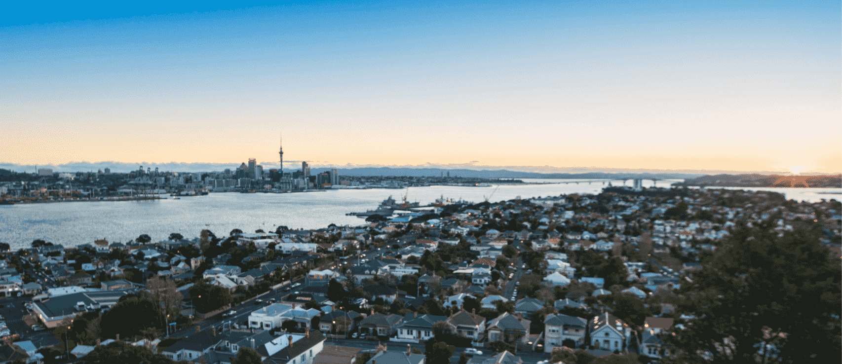 Auckland skyline at sunset as featured in a 2026 Quashed article about NZ property tools.