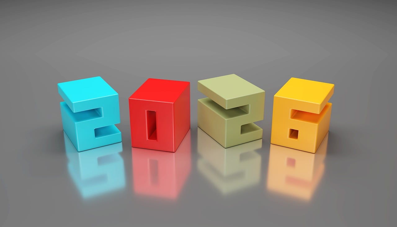 The number 2026 formed with colourful blocks on a desk, representing the key market changes affecting Tower Insurance car insurance customers in 2026, as explained by Quashed.