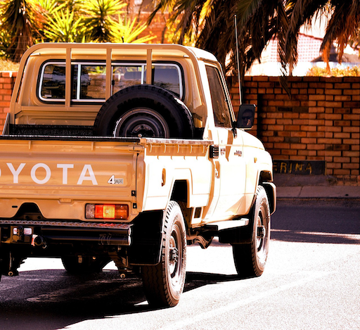 A Toyota ute in a New Zealand car park, representing the comprehensive car insurance comparison between AA Insurance and competitors that Quashed provides in 2026.