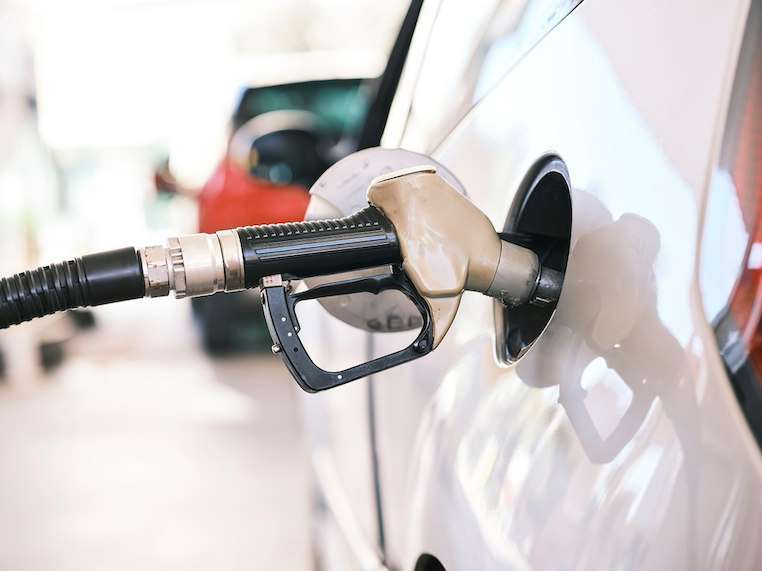 A Kiwi driver filling up their car at a New Zealand petrol station.