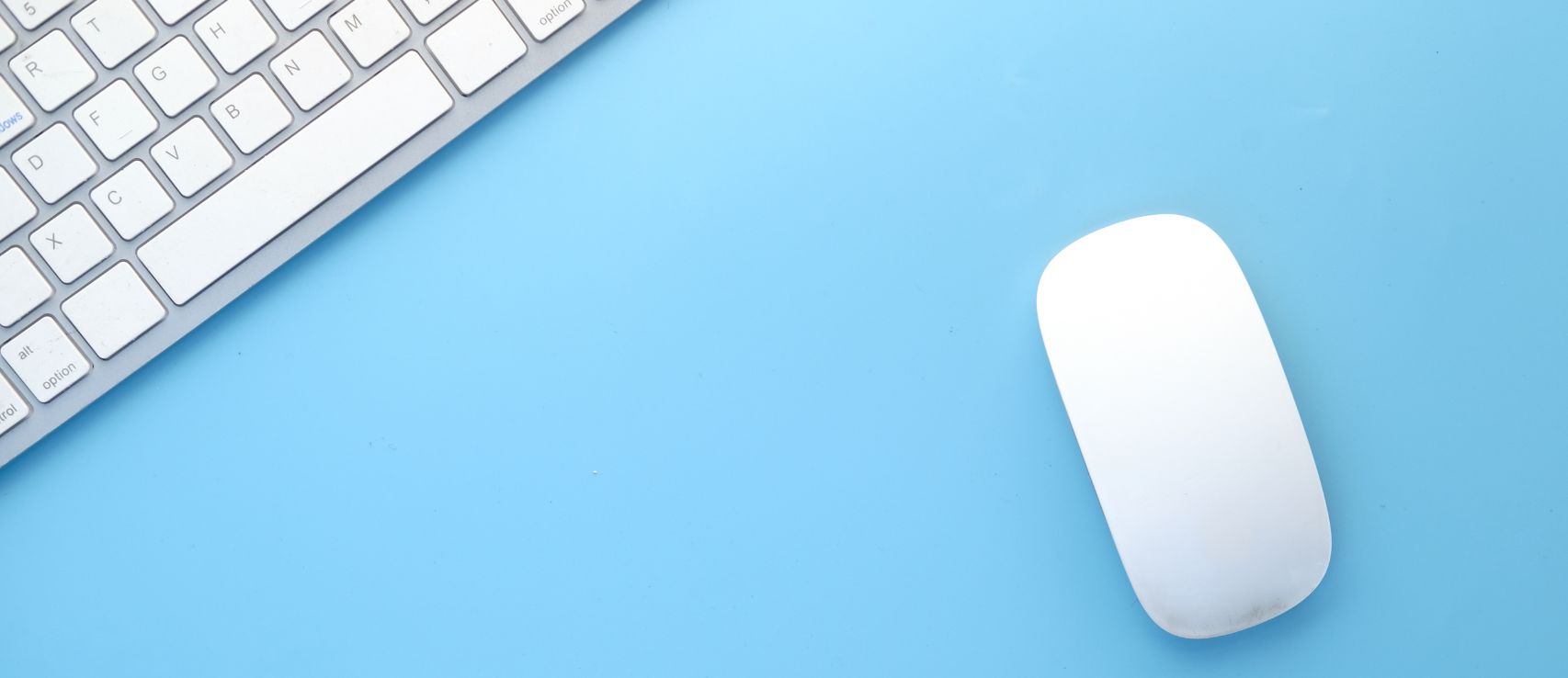 Mouse and keyboard representing New Zealanders comparing car insurance quotes online using Quashed in 2026.