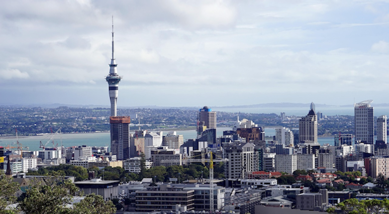 An aerial view of the Auckland skyline featuring the Sky Tower and the Vero Centre, the headquarters of Vero Insurance New Zealand in 2026.