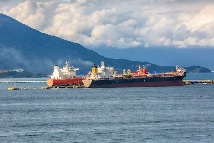 Ships transporting oil, representing the disruption to oil supply through the Strait of Hormuz that is driving New Zealand petrol prices to record highs in 2026.