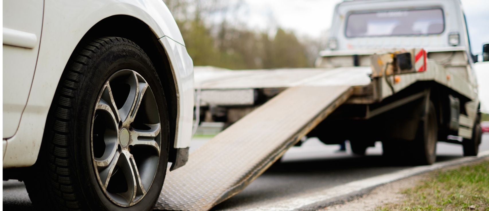 Car being towed, representing the need for the correct type of insurance in NZ. Featured in a Quashed 2026 article.