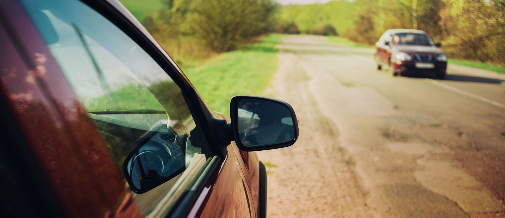 Vehicle parked on road, representing driving risks and the importance of having the right type of insurance coverage in NZ. Featured in a Quashed 2026 article.
