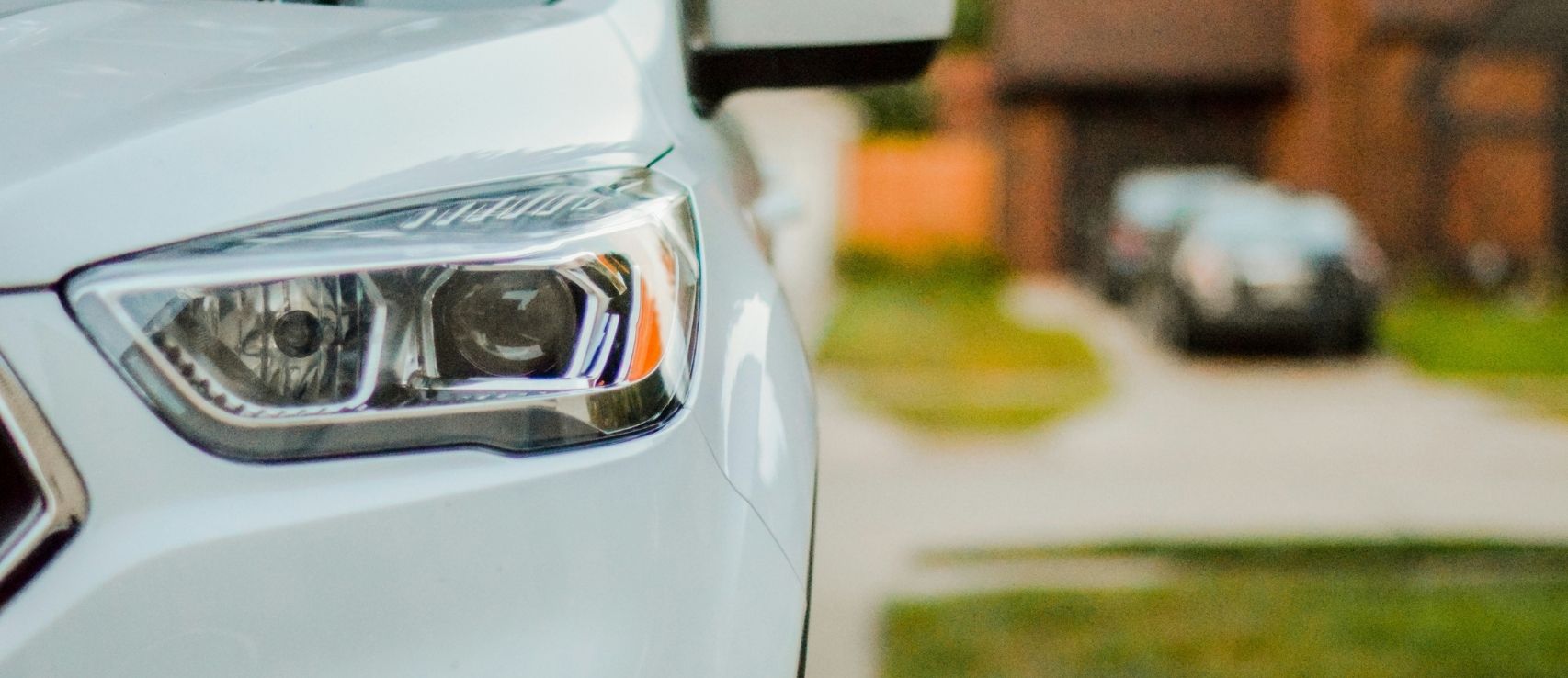 Car parked at New Zealand home showing insurance comparison opportunities featured in a Quashed 2026 guide.