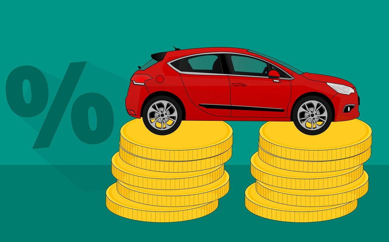 Illustration of a red car on stacks of gold coins, symbolizing 2026 car insurance premium savings with Quashed.
