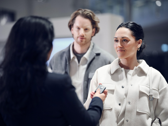 A private seller handing car keys to a buyer for a vehicle listed on Trade Me, representing the insurance risks Kiwi sellers face during test drives, handovers, and change of ownership in 2026.
