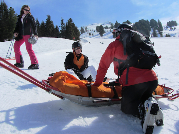 A traveler receiving medical assistance on a ski slope, highlighting the overseas medical cover gaps that Quashed helps New Zealanders identify in this 2026 article.