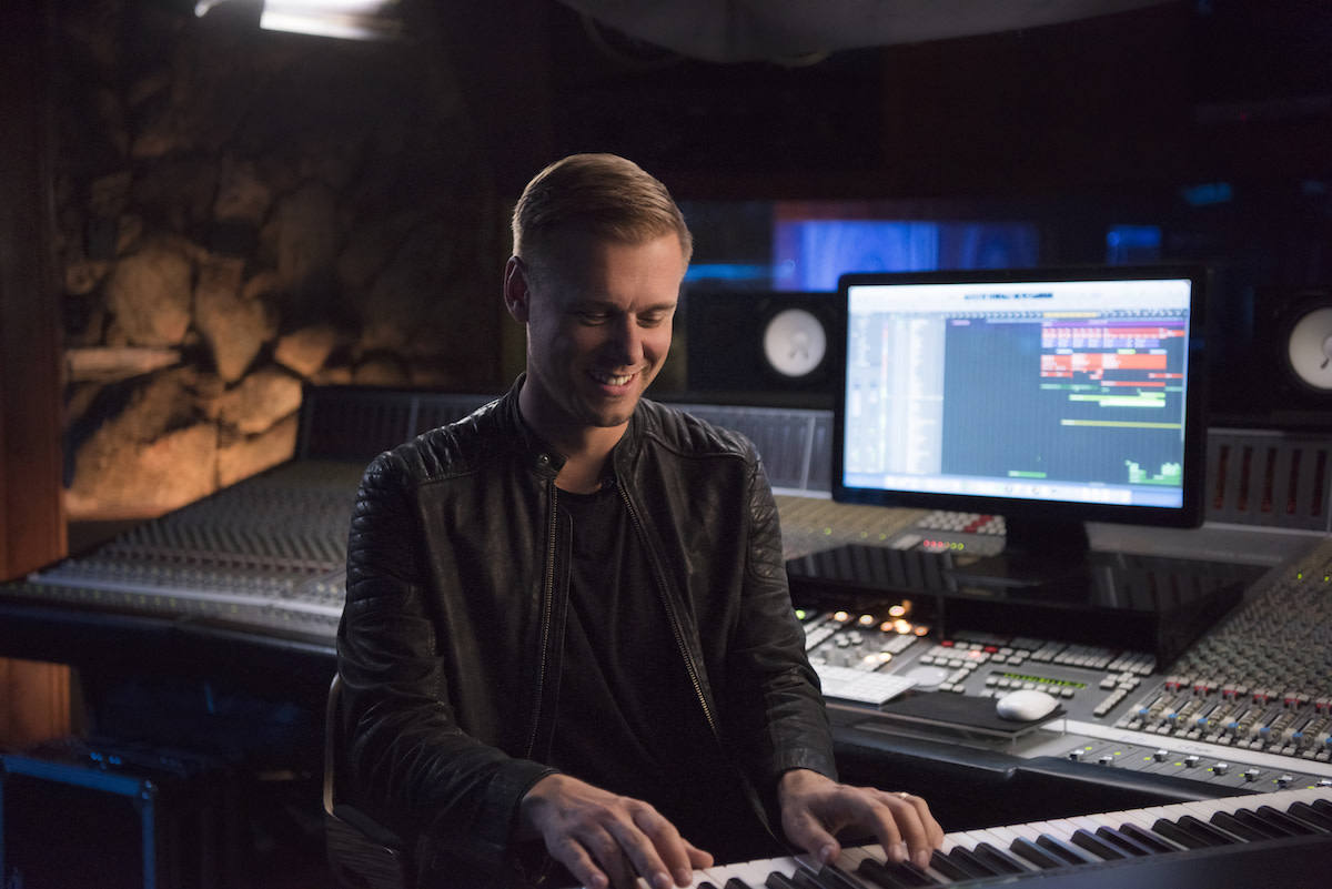 Armin van Buuren playing piano in studio