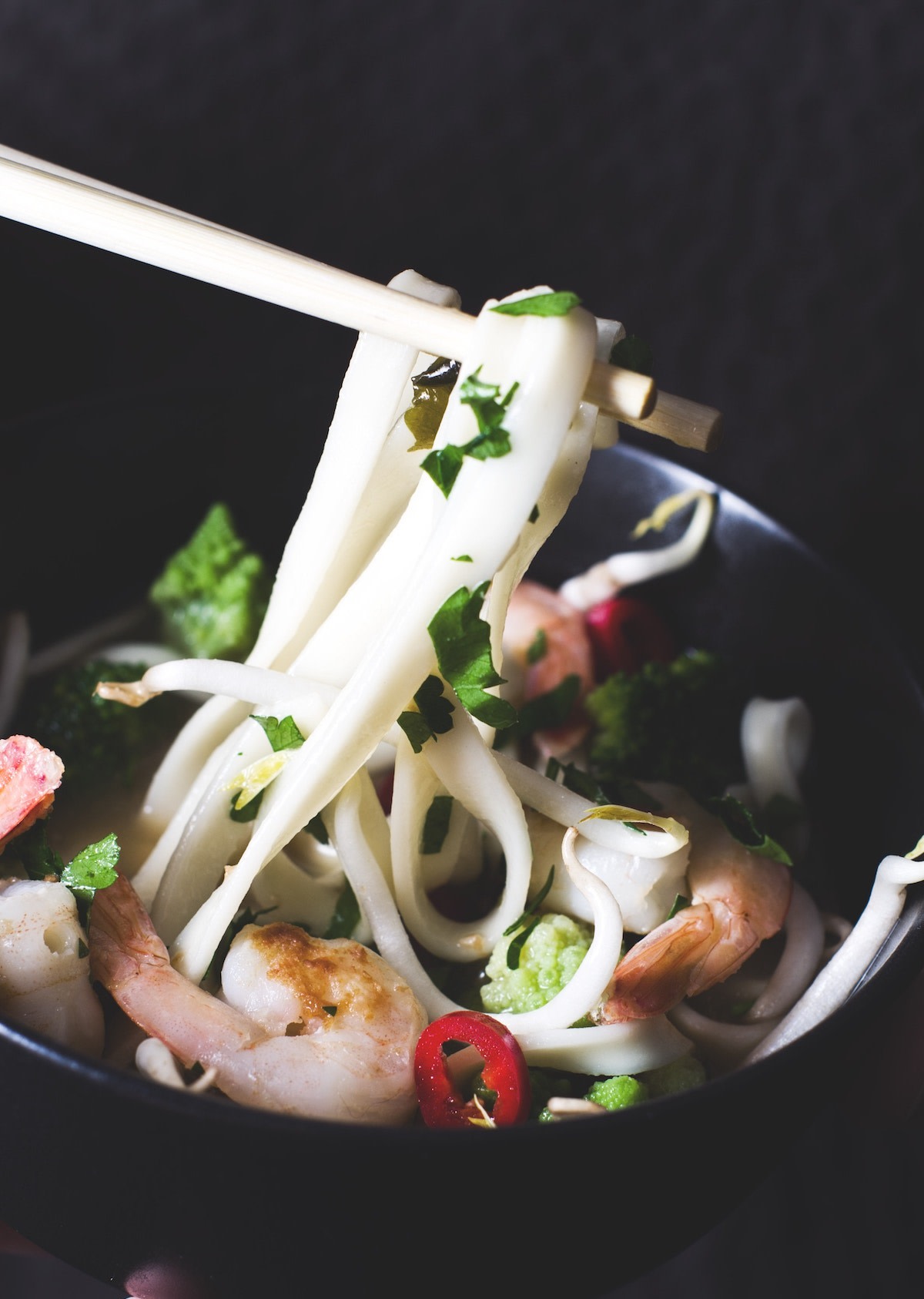 Udon noodles in bowl with chopsticks 