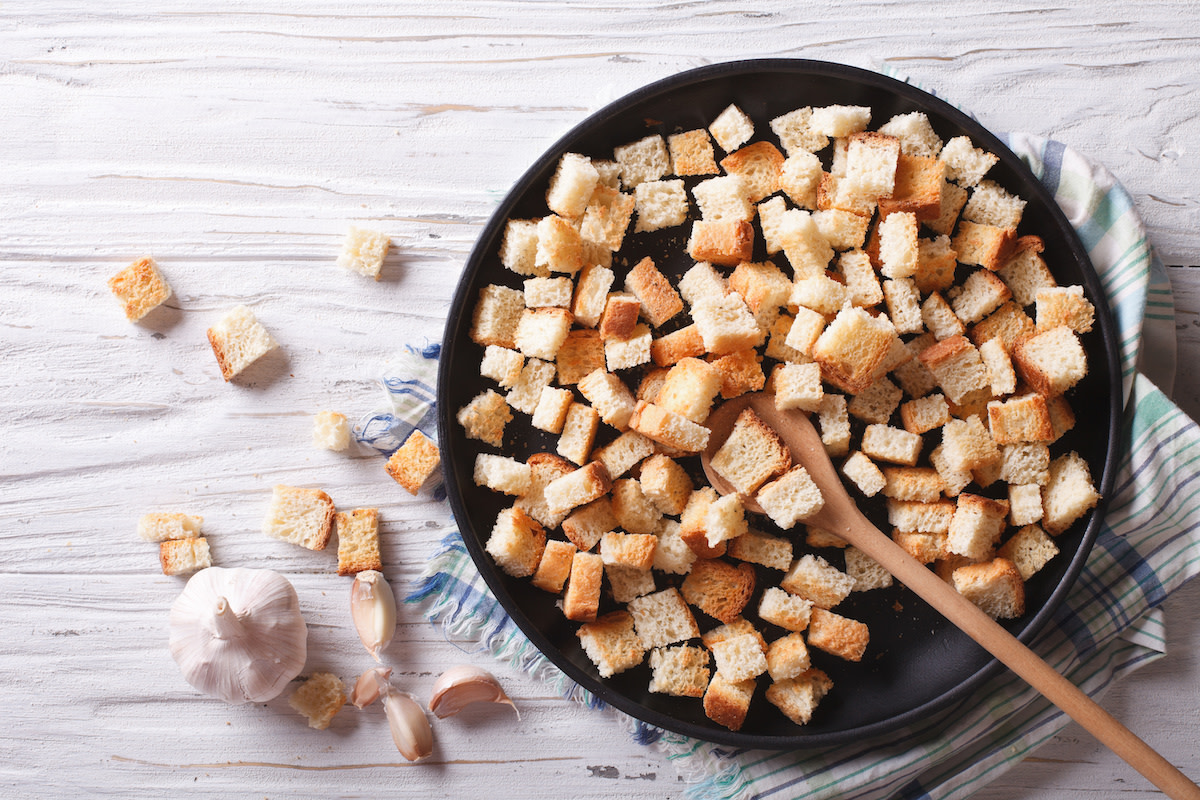 Homemade croutons in bowl with garlic