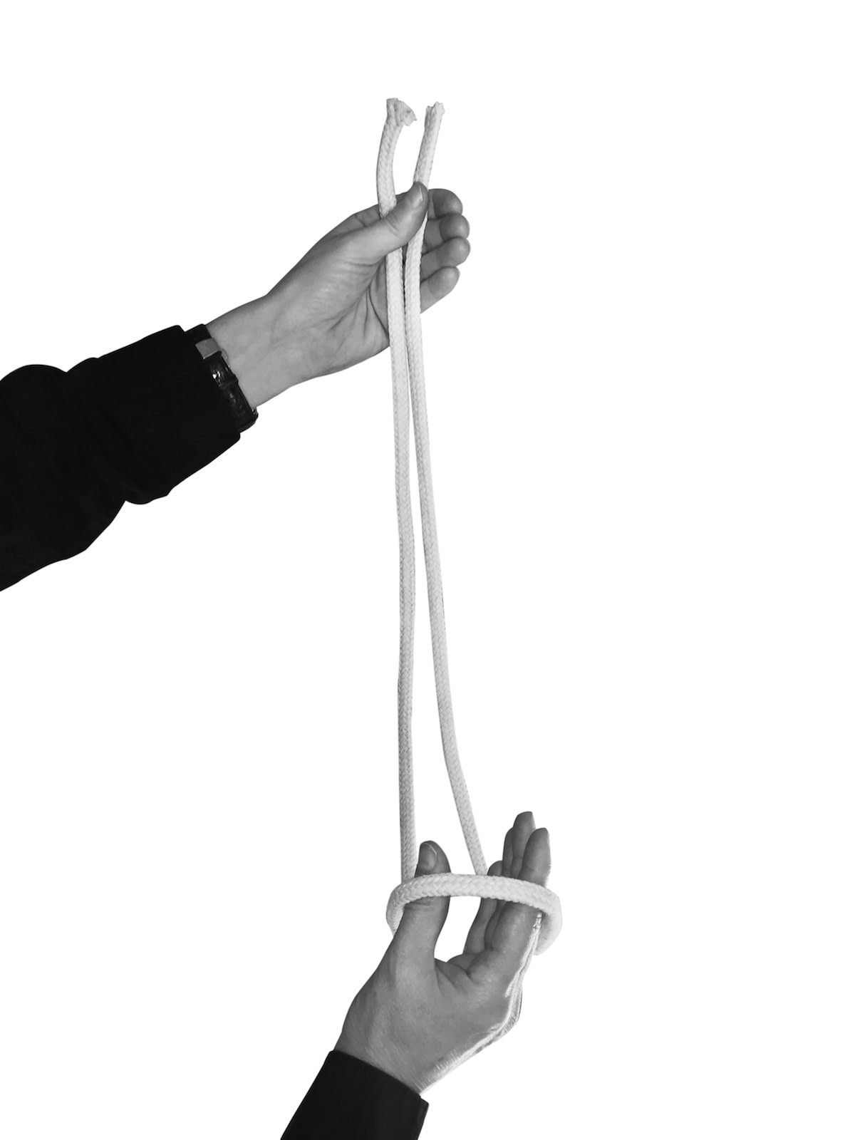 Person holding folded rope and looping hand through bottom