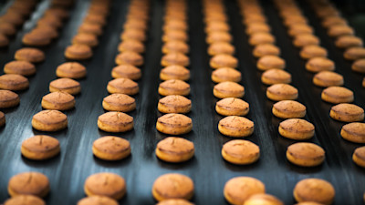 Baked goods being produced in factory on conveyer belt