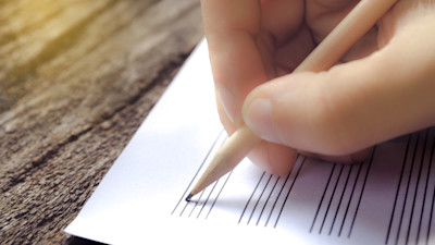 hand on music sheet