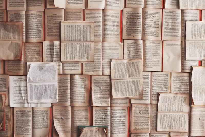 a wall of writing and books