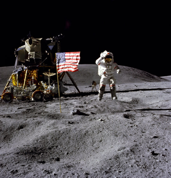 Person on moon with american flag