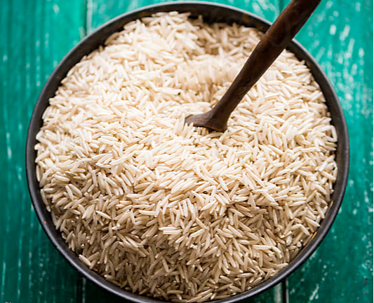 Basmati rice in bowl with teal background