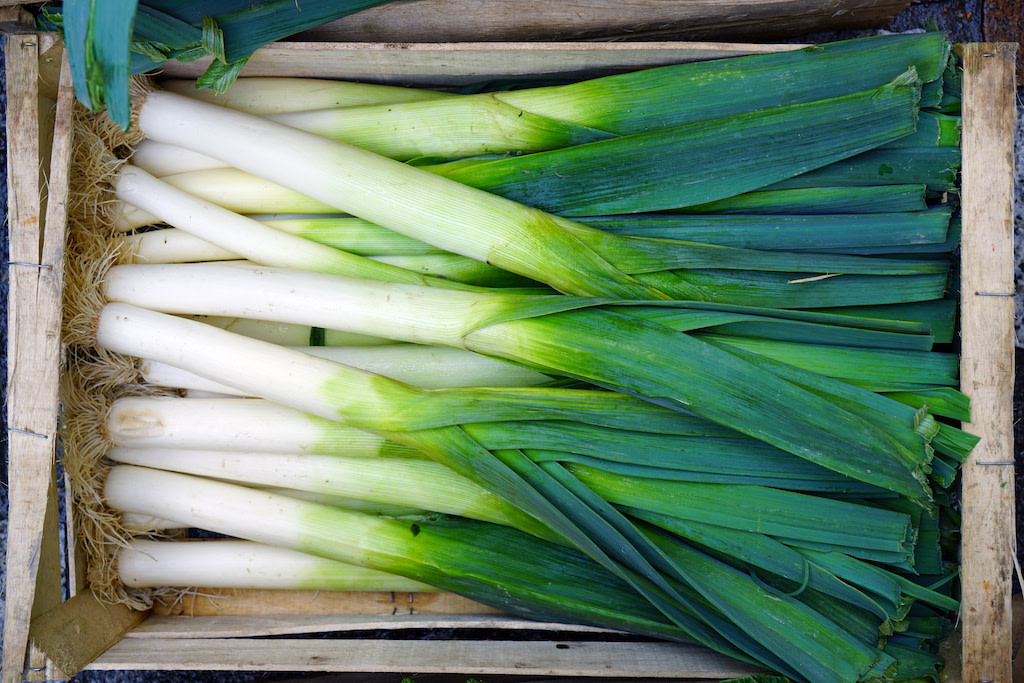 a box full of fresh leeks