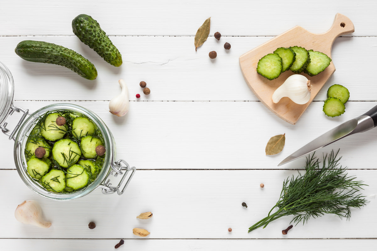 Pickle ingredients on white wood