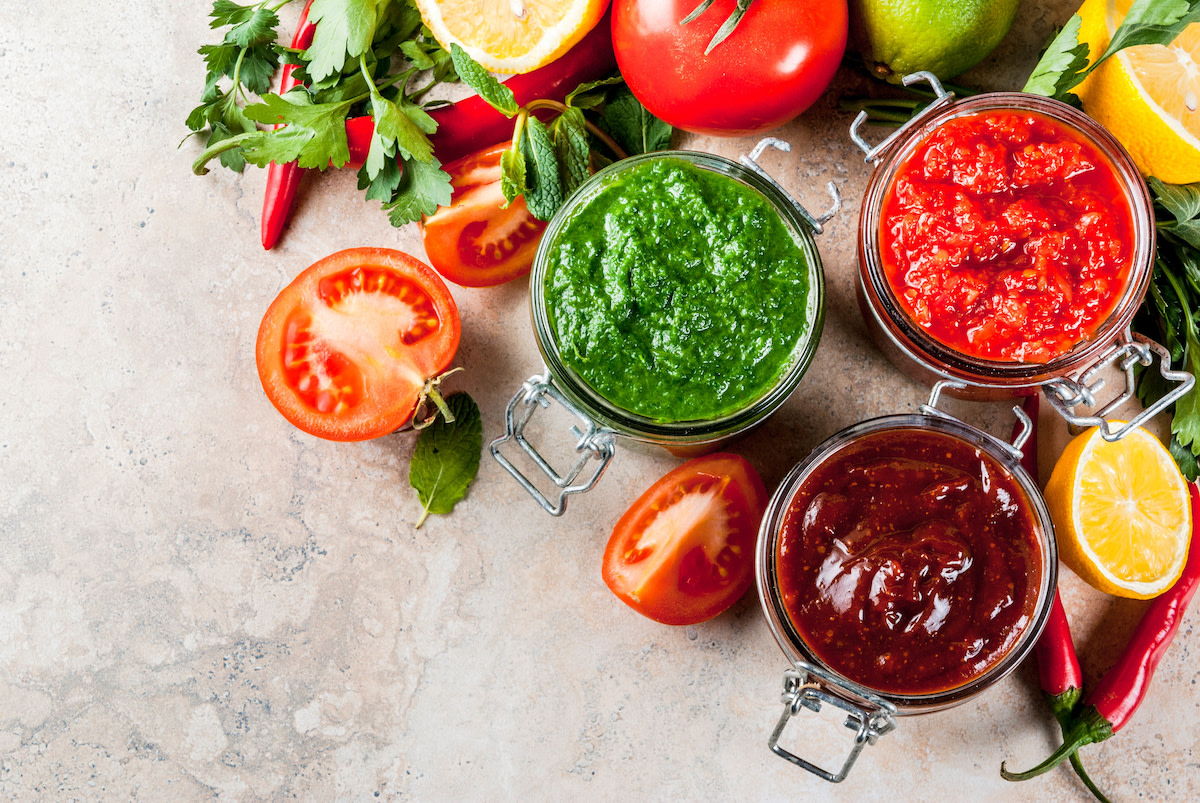 various chutneys on a table