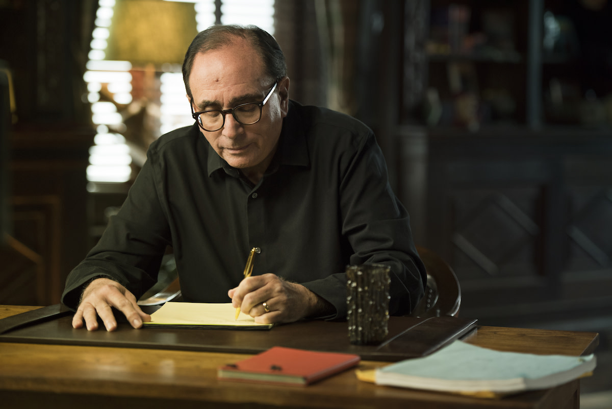 R.L. Stine writing at desk