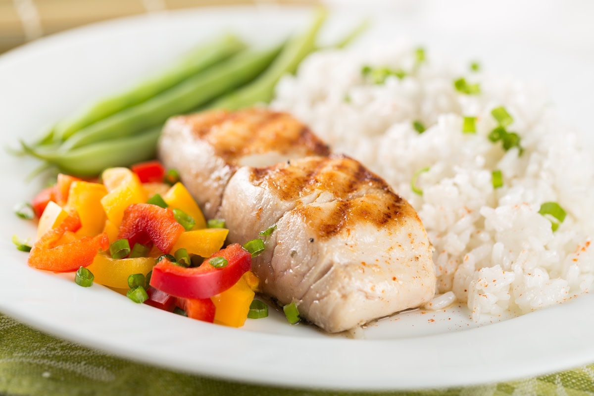 Mahi-Mahi with white rice and vegetables on plate