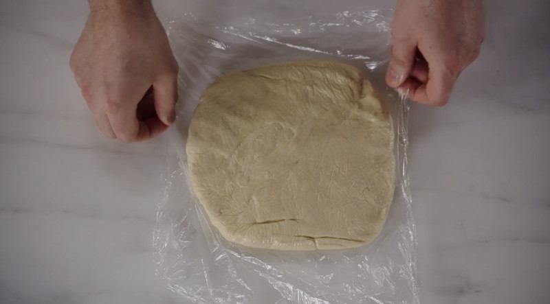 Dough in plastic wrap