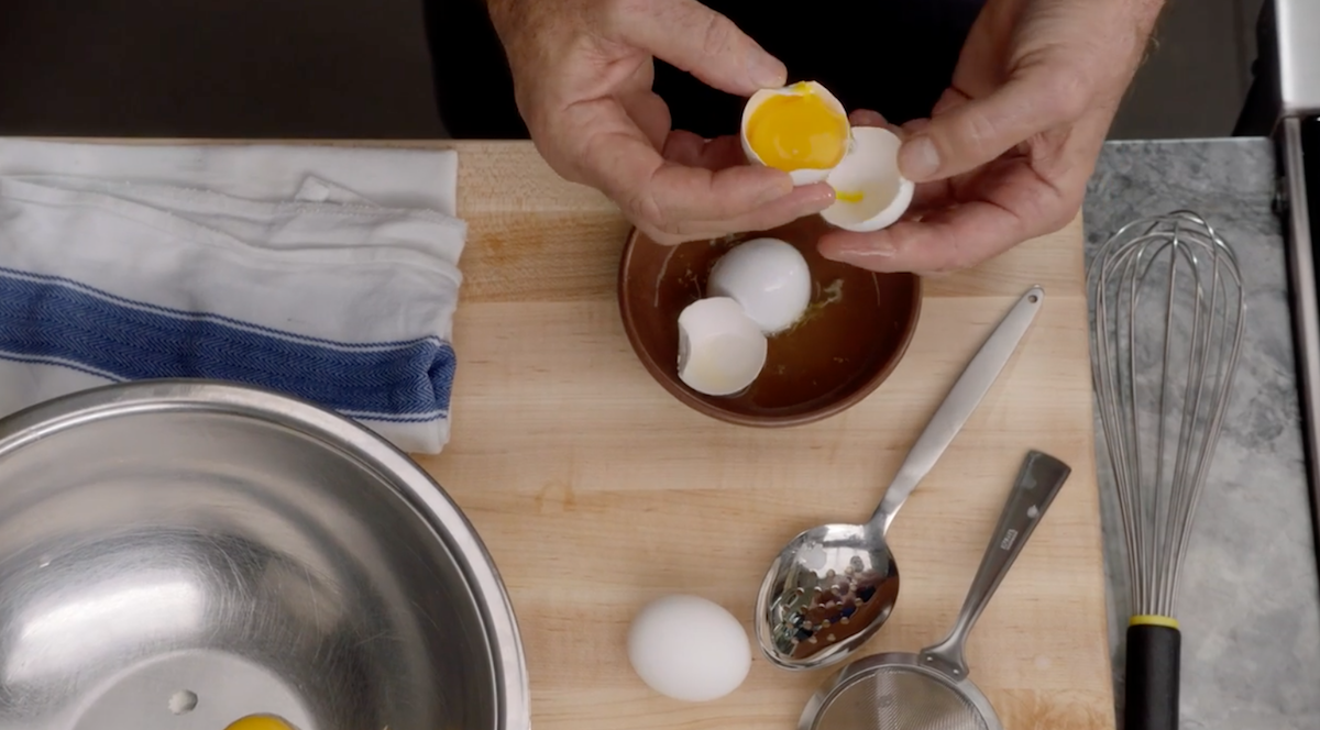 Thomas Keller separating egg yolks from eggs