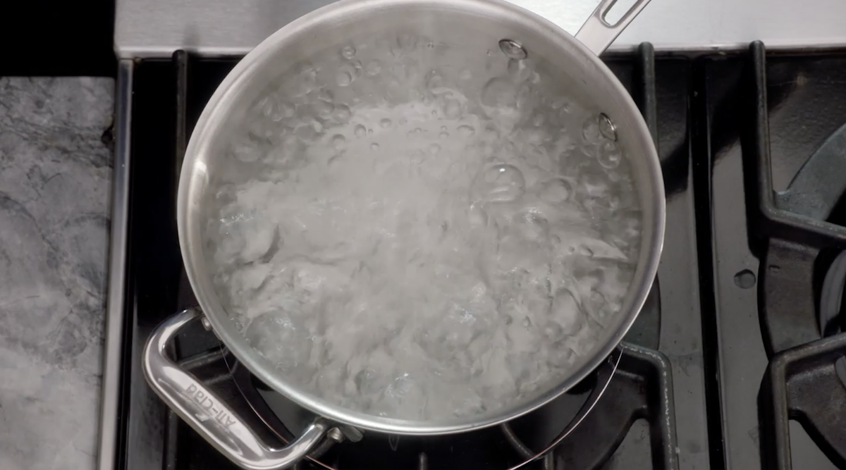 Boiling water in pot on stove