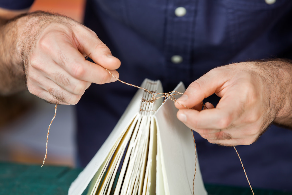 Person making a hardcover book