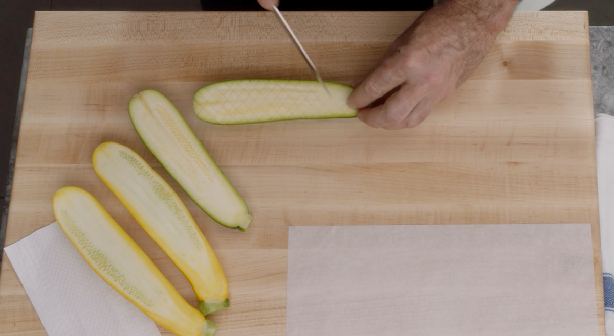 Thomas Keller scoring zucchini flatlay