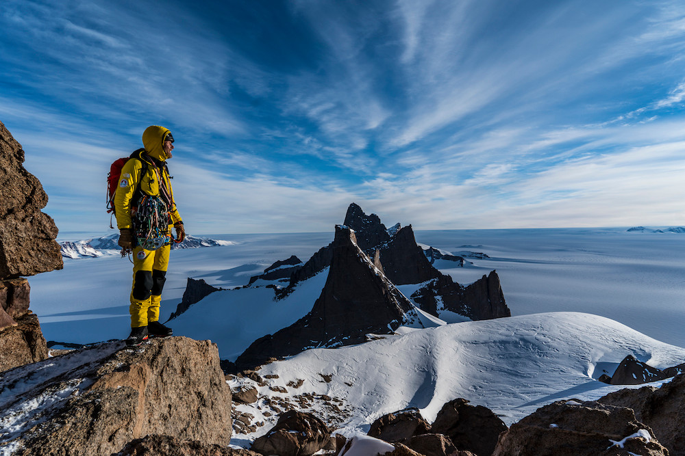 Jimmy Chin's photograph using natural light of a man hiking in snow