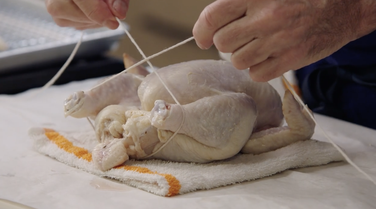 Thomas Keller trussing a chicken 2