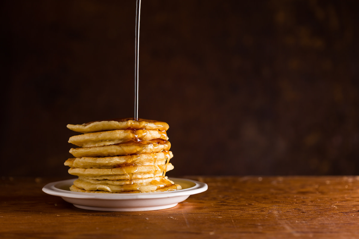 a stack of pancakes covered in syrup