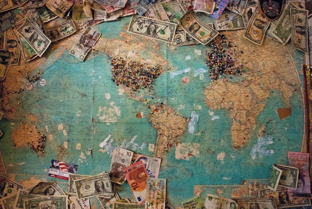 A map of the world with various currencies from different economies